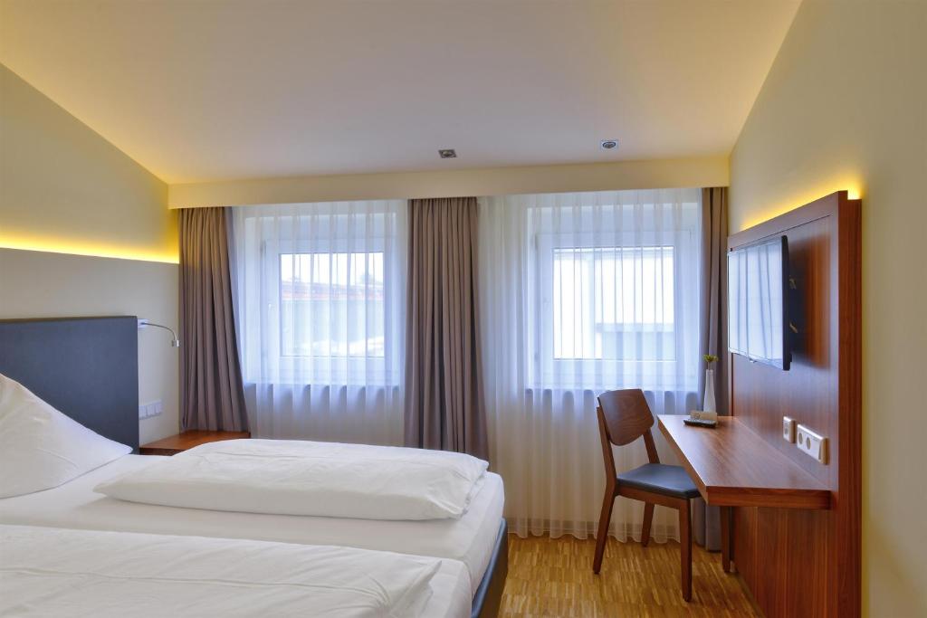 Postel nebo postele na pokoji v ubytování Hotel Apfelbaum