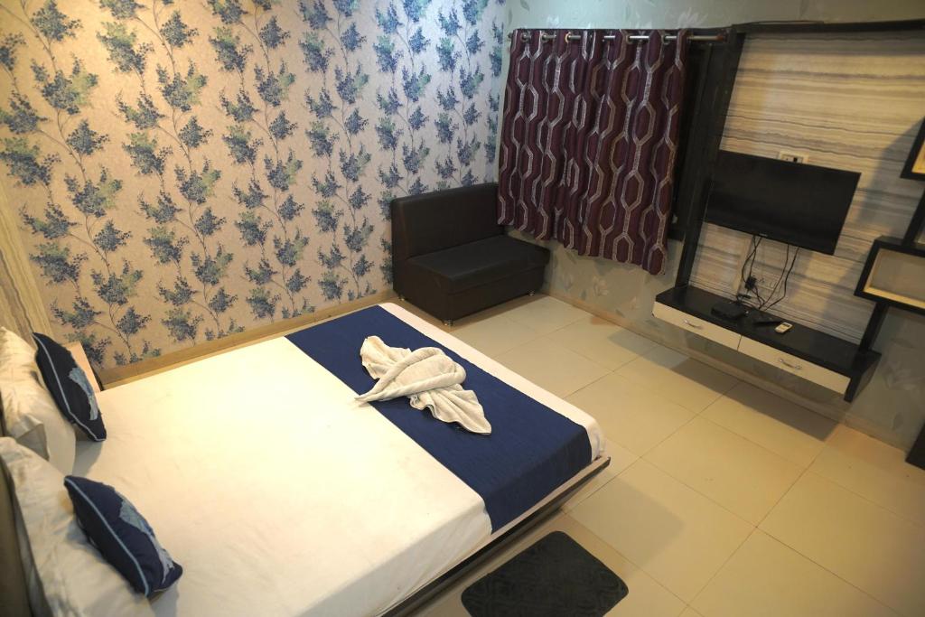 Ένα ή περισσότερα κρεβάτια σε δωμάτιο στο Hotel Pride