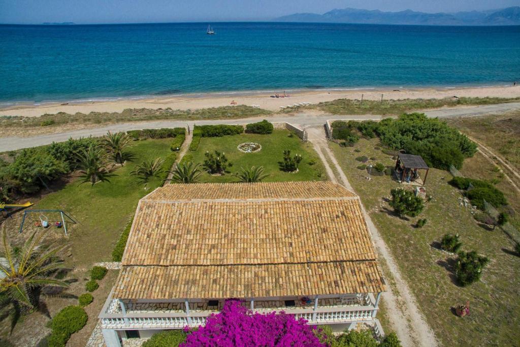 an aerial view of a building on the beach at Elli Beach Apartments and Studios in Almiros Beach
