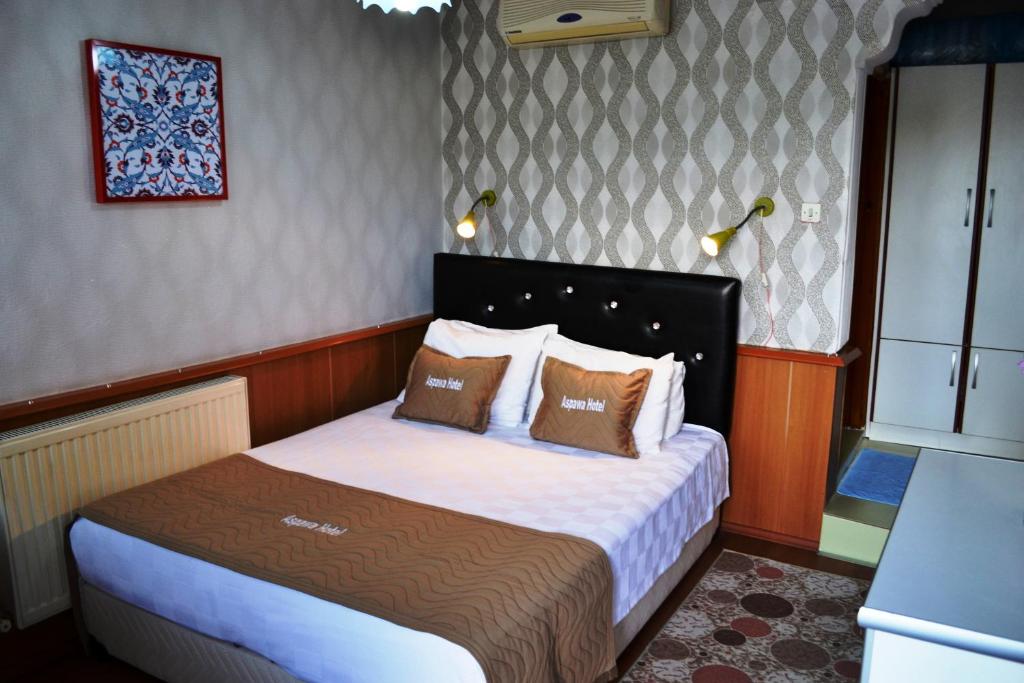 Giường trong phòng chung tại Aspawa Hotel