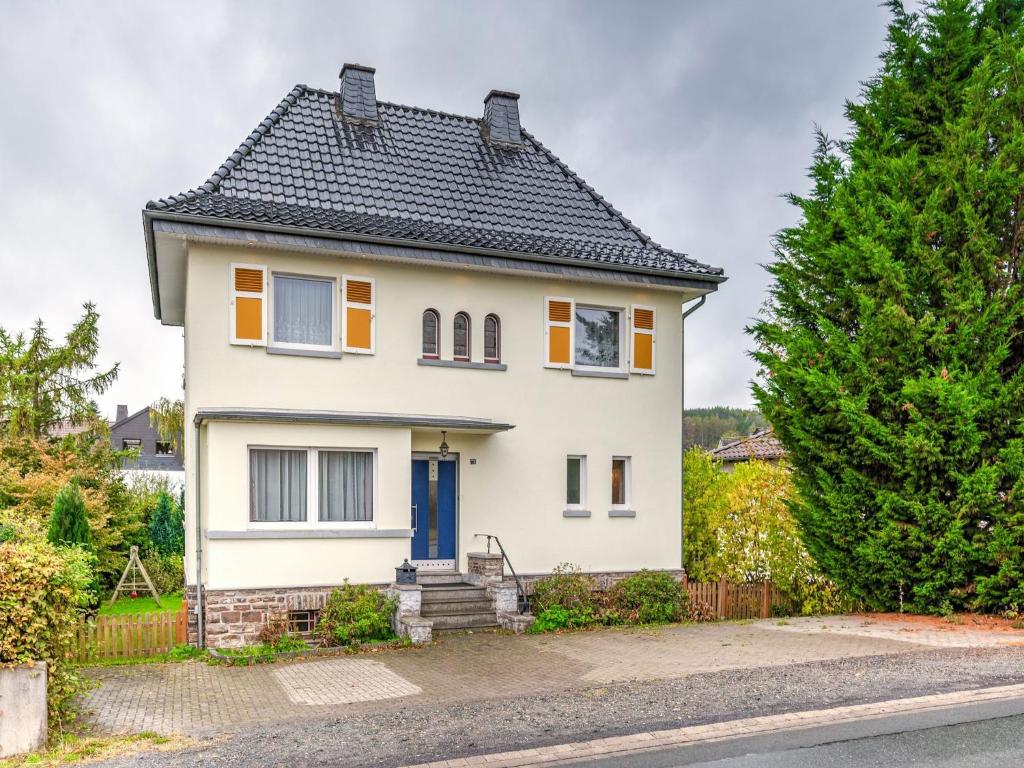 a white house with a black roof at Villa in Zentrumsnähe, Medebach in Medebach