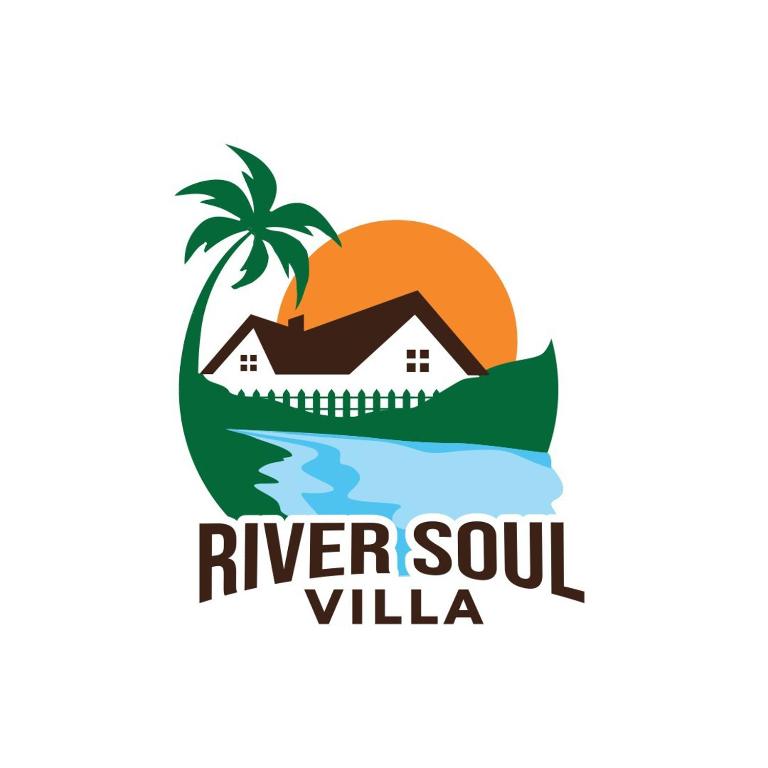 a house on the island with a palm tree and the inscription river soul villa at River Soul Villa, Vagamon in Kattappana