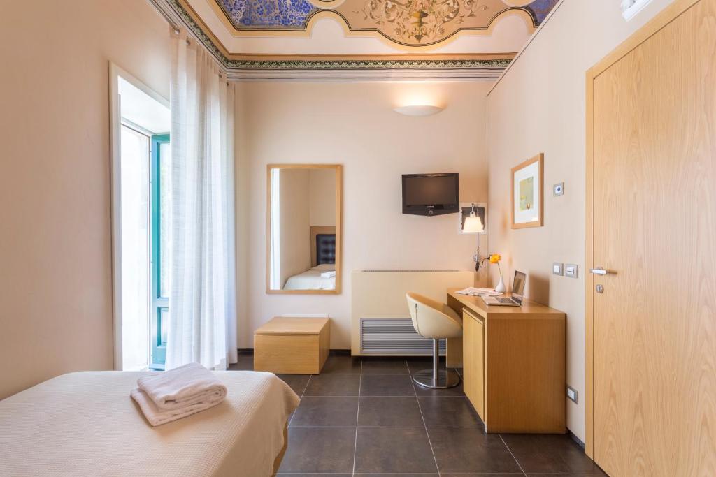 TV a/nebo společenská místnost v ubytování Hotel Novecento