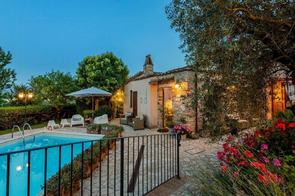 a villa with a swimming pool in a yard at Historic Village With Pool Near Todi in Todi