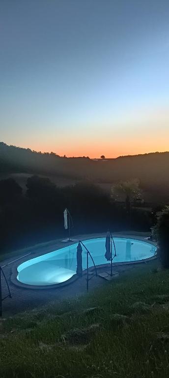 a small swimming pool in the middle of a field at Le Hameau Saint-Julien in Engayrac