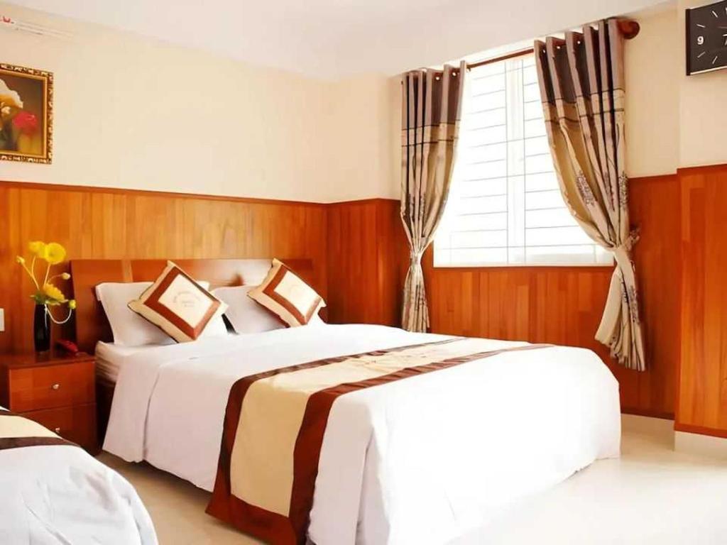 Ένα ή περισσότερα κρεβάτια σε δωμάτιο στο Belvilla Near Lotte Mart Formerly Nam Phuong Hoang Hau