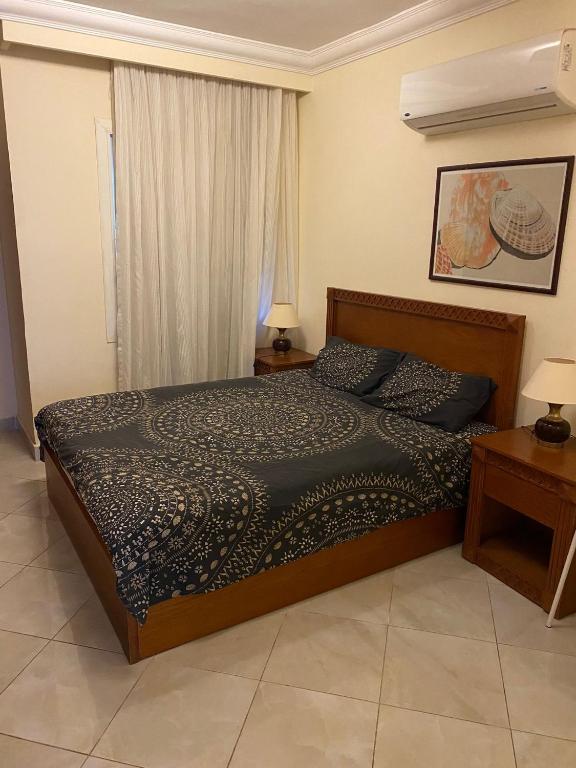 a bedroom with a bed and a window at Delta sharm in Sharm El Sheikh