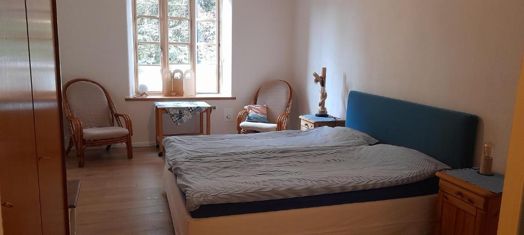 Ένα ή περισσότερα κρεβάτια σε δωμάτιο στο Gemütliche Ferienunterkunft direkt am Meer
