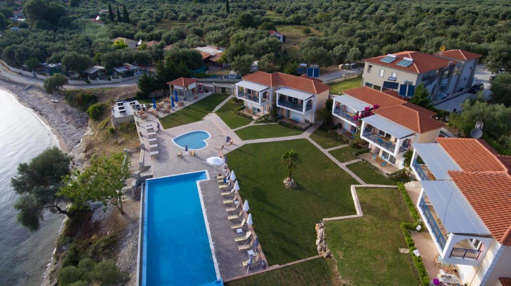 an aerial view of a house with a swimming pool at Thesmos Village in Mitika