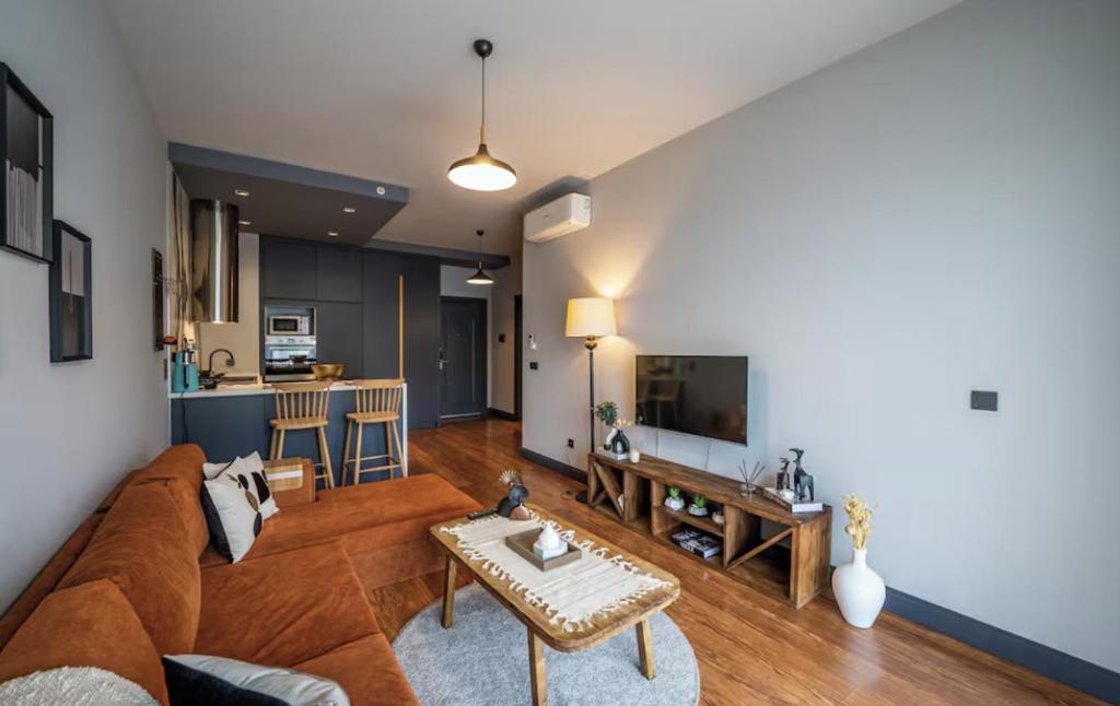 a living room with a couch and a table at Benesta Guest Teori in Istanbul