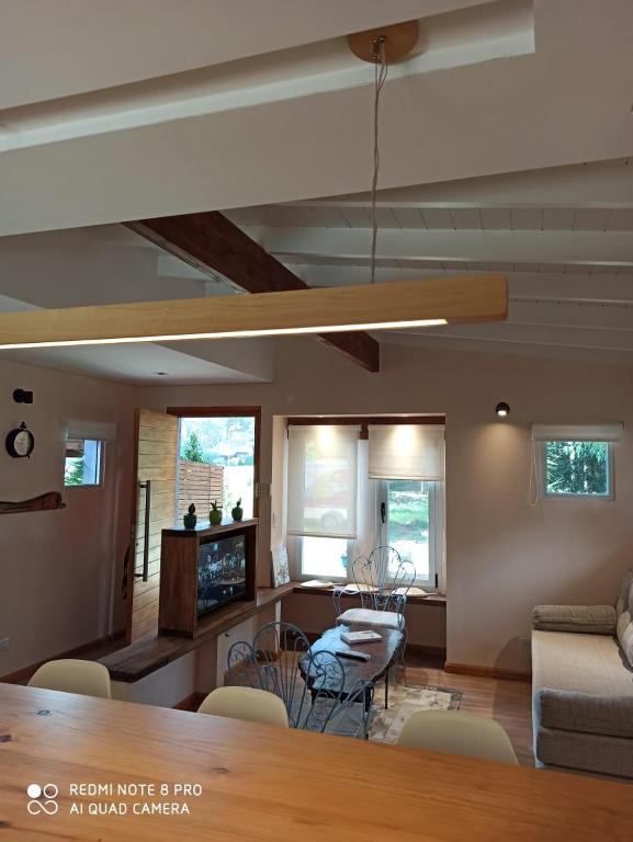a living room with a couch and a table at Duplex Luna in Pinamar