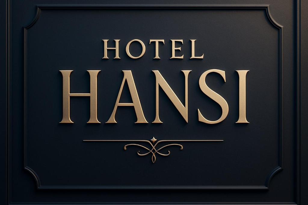 a gold sign that reads hotel harish on a black background at Hotel Hansi in Hānsi