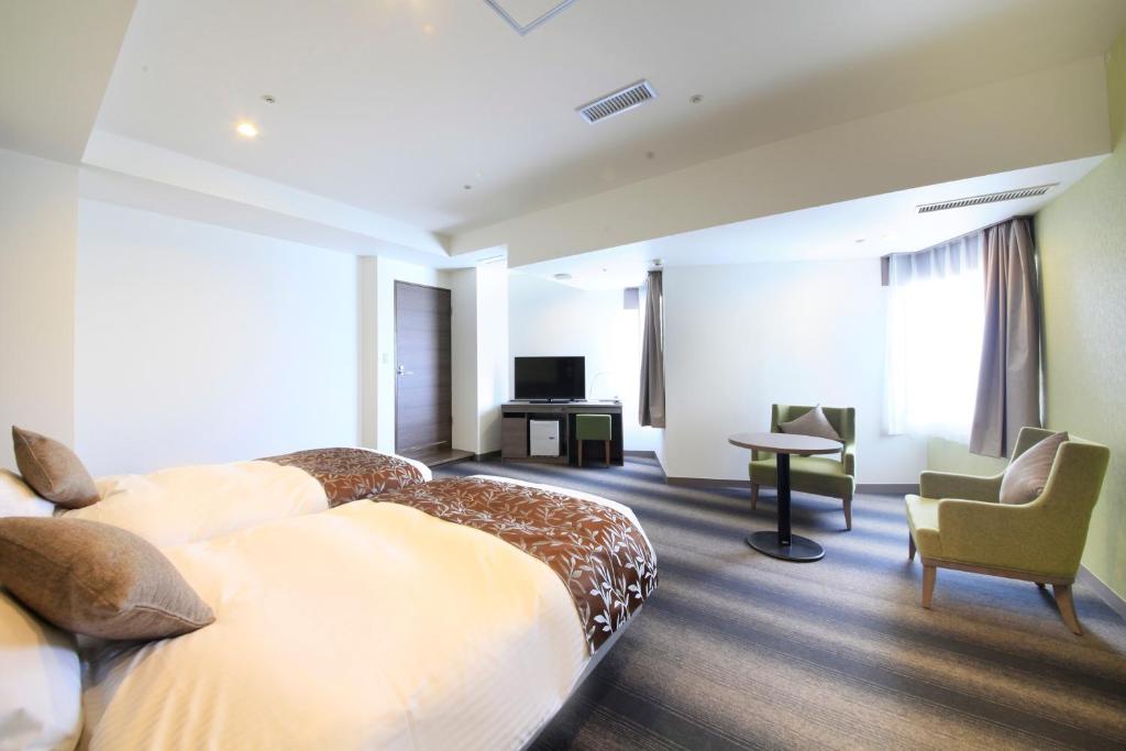 TV a/nebo společenská místnost v ubytování Hotel Sunshine Utsunomiya