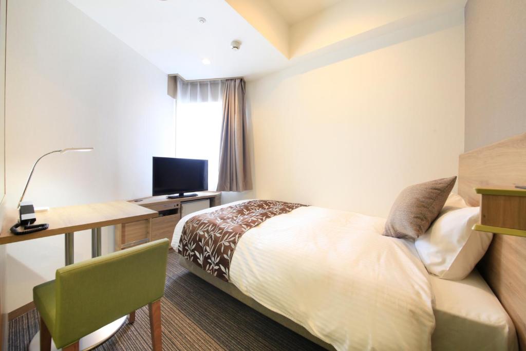 Postel nebo postele na pokoji v ubytování Hotel Sunshine Utsunomiya