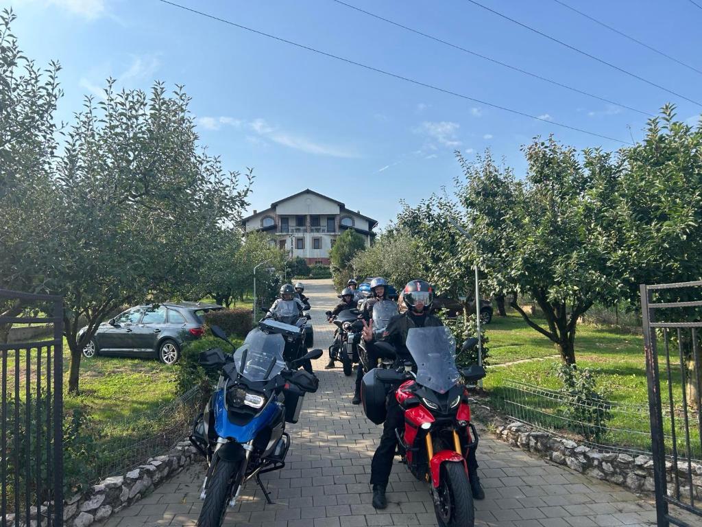 a group of people riding motorcycles down a road at Casa Borza in Alba Iulia