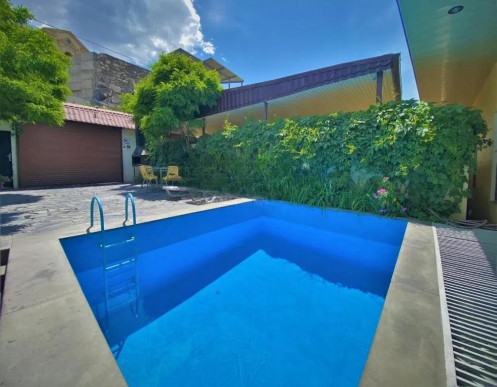 a swimming pool in the backyard of a house at Lux Villa Yerevan in Yerevan