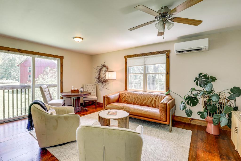 a living room with a couch and a table at Walk to River Couples Retreat in Kintnersville! in Kintnersville