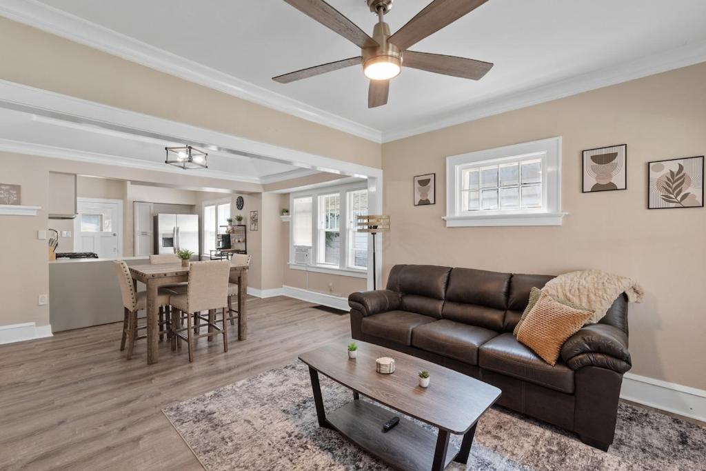 a living room with a couch and a table at Cozy 3BR for Traveling Nurse and Families by Mys House in Milwaukee