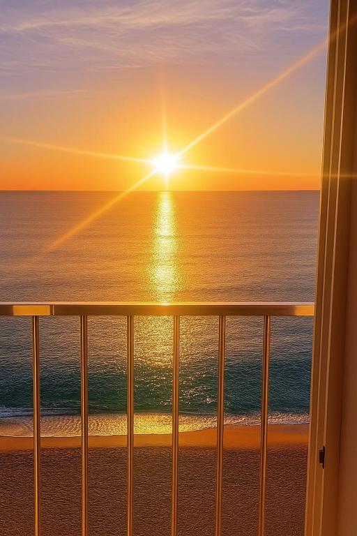 a view of the ocean at sunset from a balcony at Bravamar, Playa de Aro, vistas al mar in Platja d'Aro