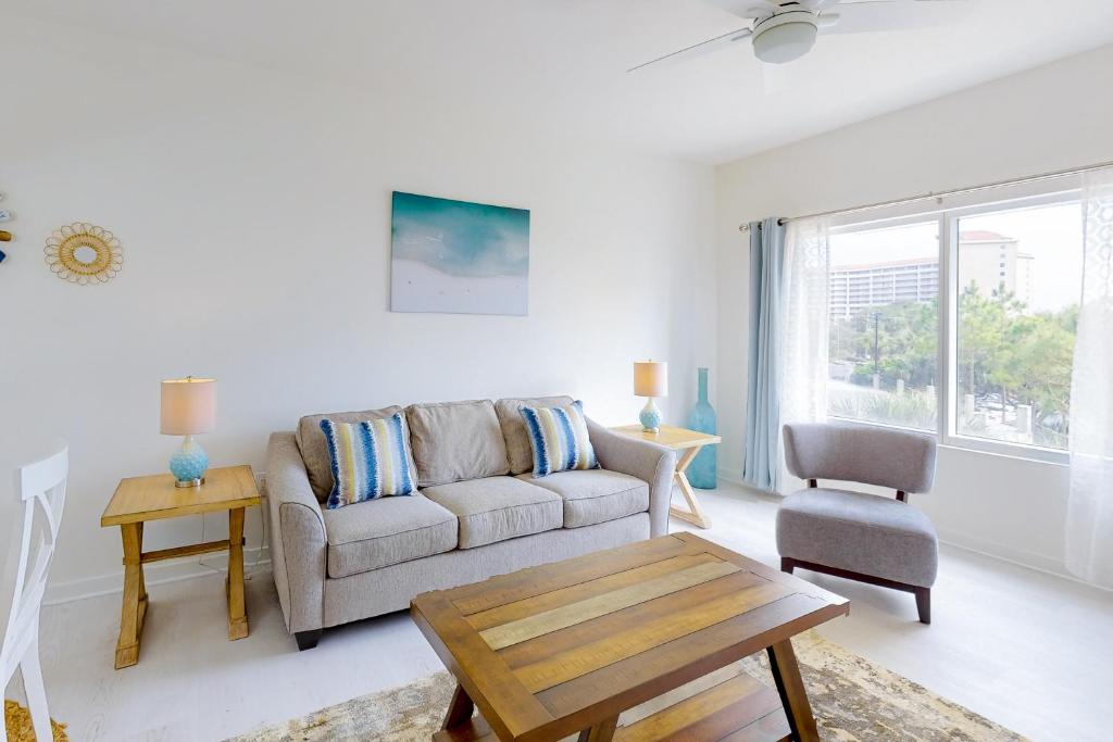a living room with a couch and a table at Luau II 6229 in Destin