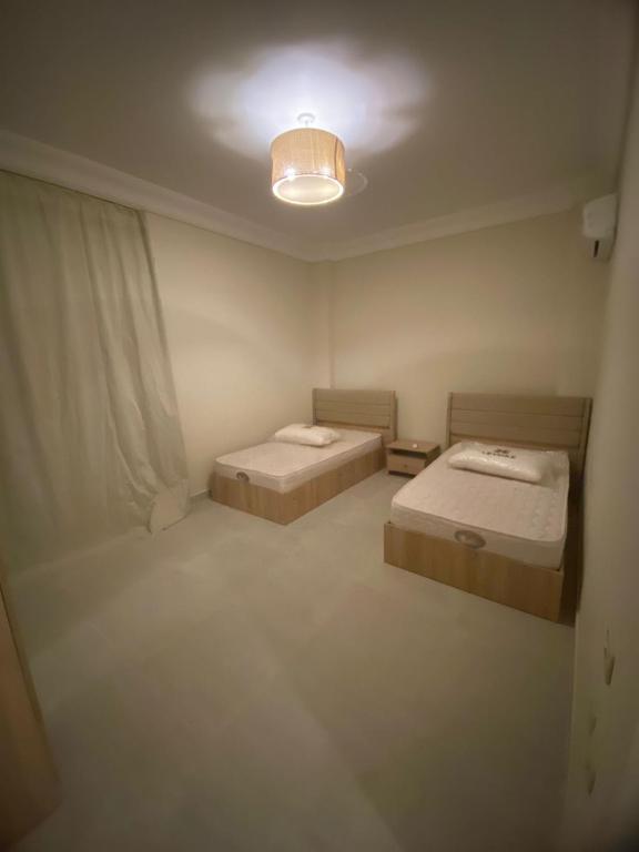 Ένα ή περισσότερα κρεβάτια σε δωμάτιο στο Lavsita ras al hikma