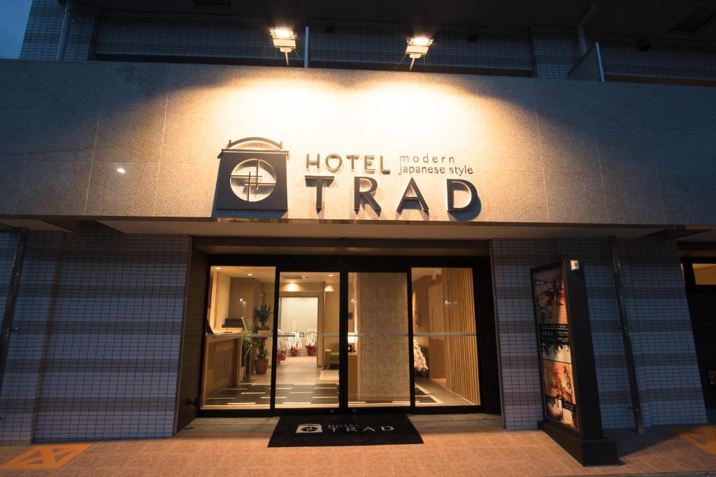 a hotel fraud sign on the front of a building at Hotel Trad in Osaka