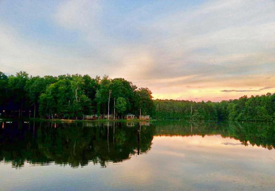 a view of a lake with trees in the background at Lake Myers Lakeside Villa 16 in Mocksville