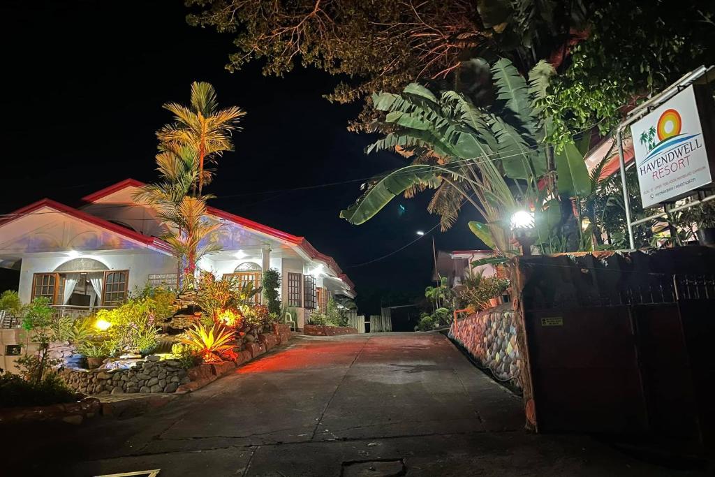 a house at night with lights on a street at Havendwell Garden Resort in Bokbok