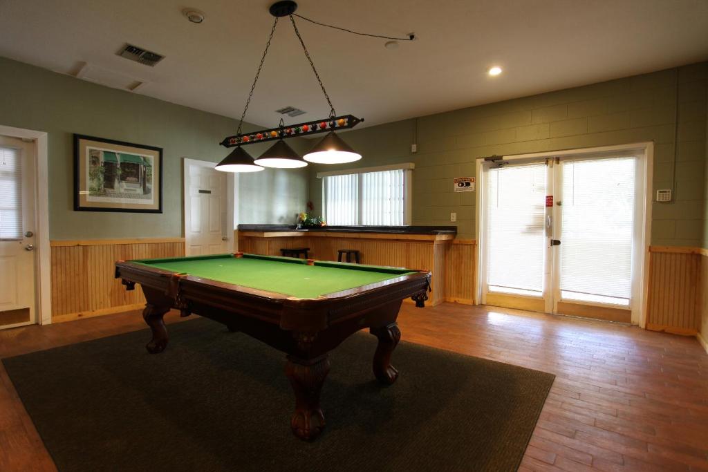 a living room with a pool table in it at Sherwood Forest Cottage 6 in Kissimmee