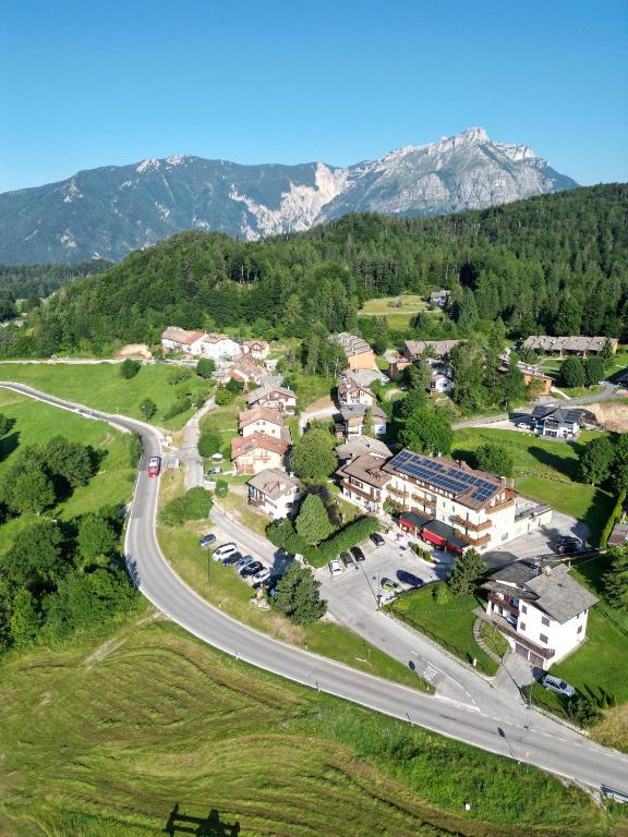 an aerial view of a town with a road at Residence Capriolo in Lavarone