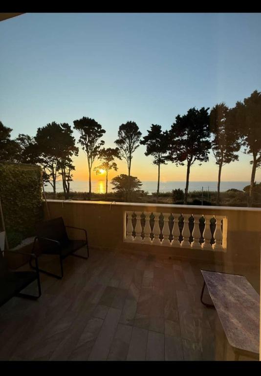 a view of the sunset from the balcony of a house at Sara B&B Accommodation in Santa Domenica