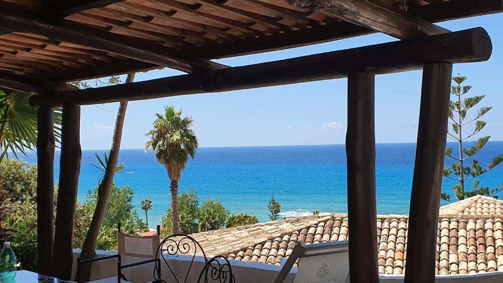 a view of the ocean from a patio at Beach villa La Genziana in Parghelia