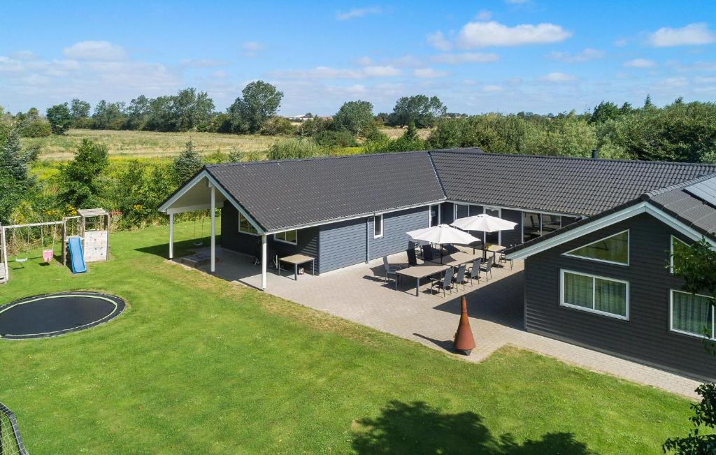 an aerial view of a house with a backyard at Beautiful Home In Idestrup With Sauna in Marielyst