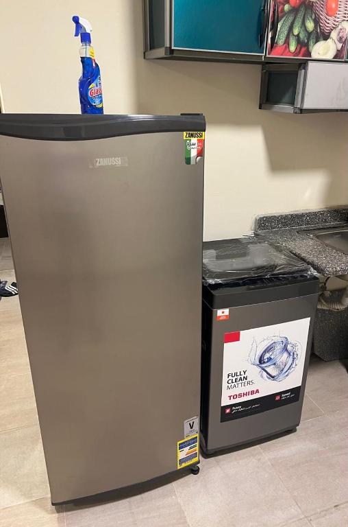 a refrigerator with a sign on the side of it at Aqwa view in El Alamein