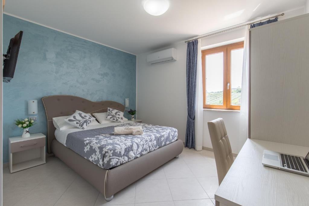 Łóżko lub łóżka w pokoju w obiekcie B&B Paradiso
