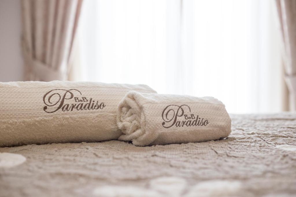 Łóżko lub łóżka w pokoju w obiekcie B&B Paradiso