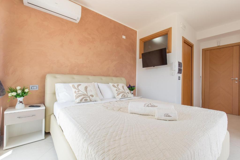Łóżko lub łóżka w pokoju w obiekcie B&B Paradiso