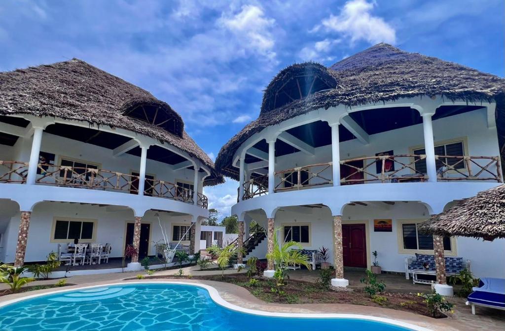a view of the villas from the pool at Papa Romolo Villa's in Watamu