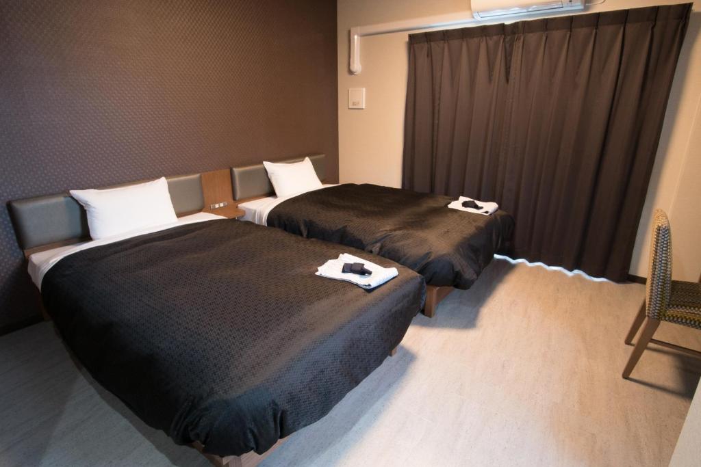 Postel nebo postele na pokoji v ubytování Hotel Trad