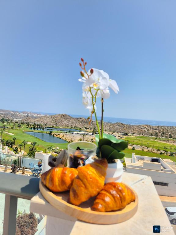 a plate of pastries on a table with a view at Soleil-Sérénité Golf Aguilón in Pilar de Jaravía