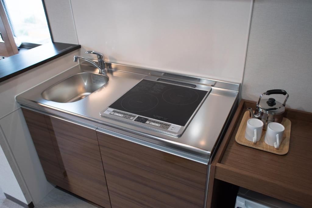 Kuchyň nebo kuchyňský kout v ubytování Hotel Trad