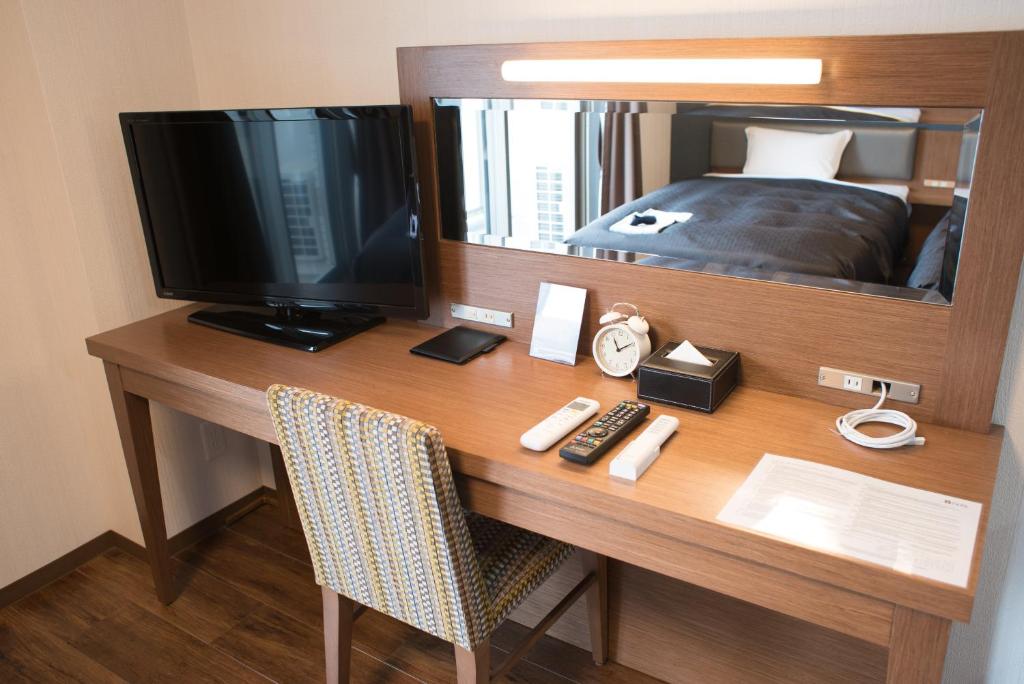 TV a/nebo společenská místnost v ubytování Hotel Trad
