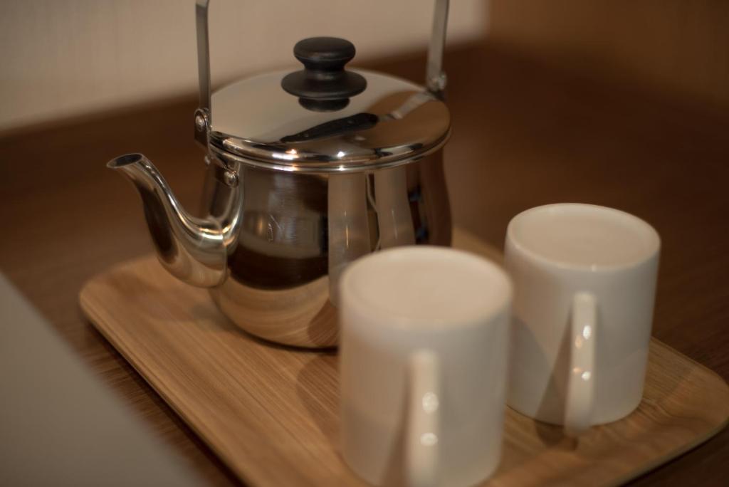 Příslušenství pro přípravu čaje a kávy v ubytování Hotel Trad