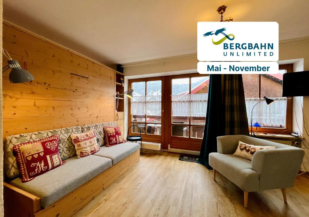 a living room with a couch and a chair at Haus Baur, Fewo Dorfstadl 37 oder Heustadl 38 in Oberstdorf