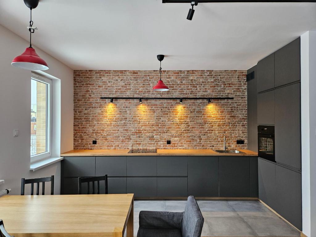 Kuchyň nebo kuchyňský kout v ubytování Apartament PROMYKA