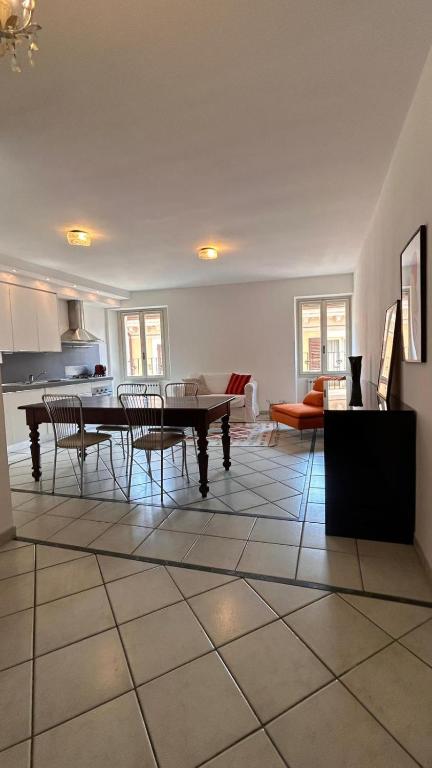 a living room with a table and chairs at La Margherita in Salò