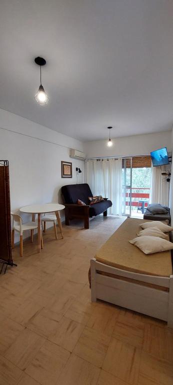 Ένα ή περισσότερα κρεβάτια σε δωμάτιο στο Monoambiente San Bernardo