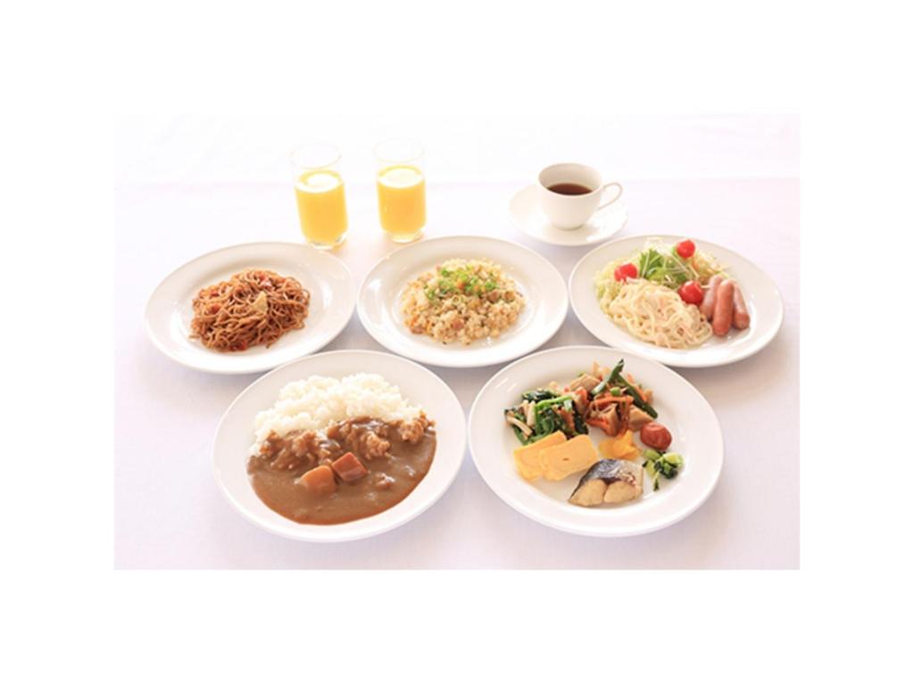 a group of plates of food on a table at Smile Hotel Shimonoseki - Vacation STAY 12507v in Shimonoseki