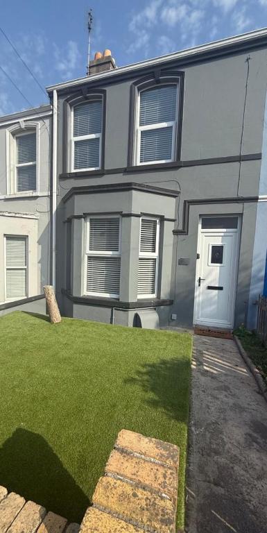 a house with a lawn in front of it at City Centre Chic in Bangor