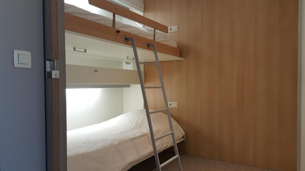 Postel nebo postele na pokoji v ubytování Vakantie Domein Ter Helme